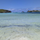 Shallow turquoise lagoon, coral reef and coastal islets in Watamu, Kenya.