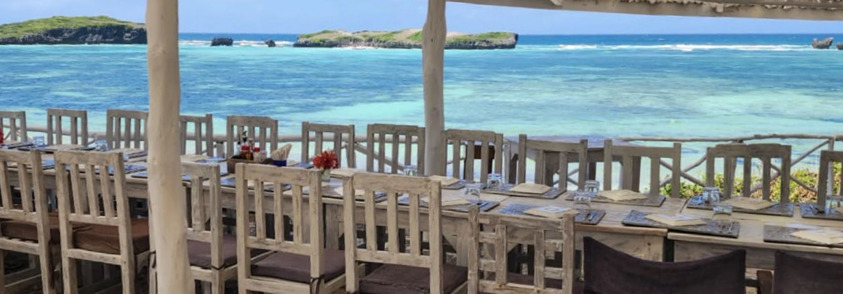 Sunny ocean weather viewed from a beachfront restaurant in Watamu, Kenya.
