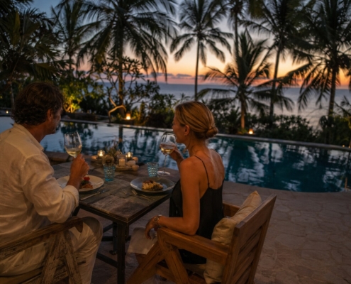 Couple enjoying a romantic poolside dinner at Visiwa Restaurant in Watamu