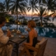 Couple enjoying a romantic poolside dinner at Visiwa Restaurant in Watamu