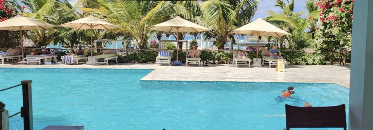 Swimming pool and tropical gardens at a beachfront resort in Watamu, Kenya.