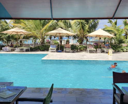Swimming pool and tropical gardens at a beachfront resort in Watamu, Kenya.