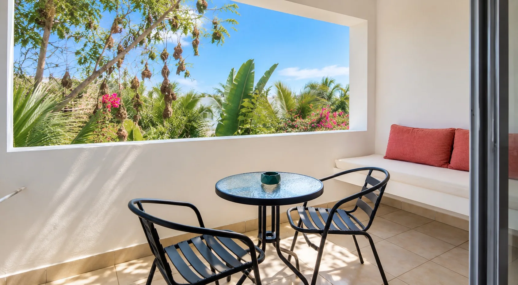 Private terrace with garden view of the Double Room at Visiwa Beach Resort, Watamu