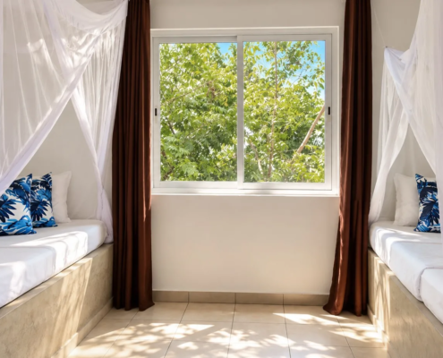 Family Suite second bedroom with single beds at Visiwa Beach Resort, Watamu