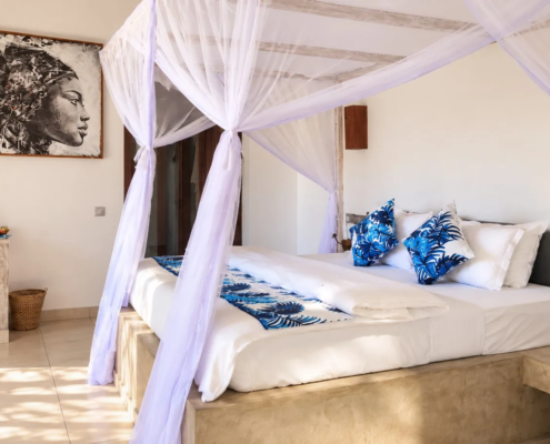 Family Suite master bedroom with canopy bed at Visiwa Beach Resort, Watamu