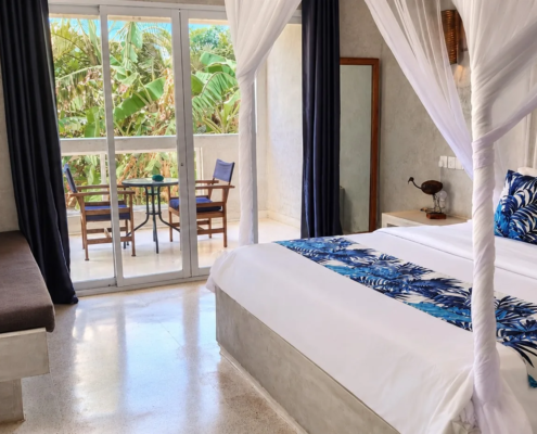 Garden View Room at Visiwa Beach Resort, Watamu – canopy bed and balcony on the tropical garden