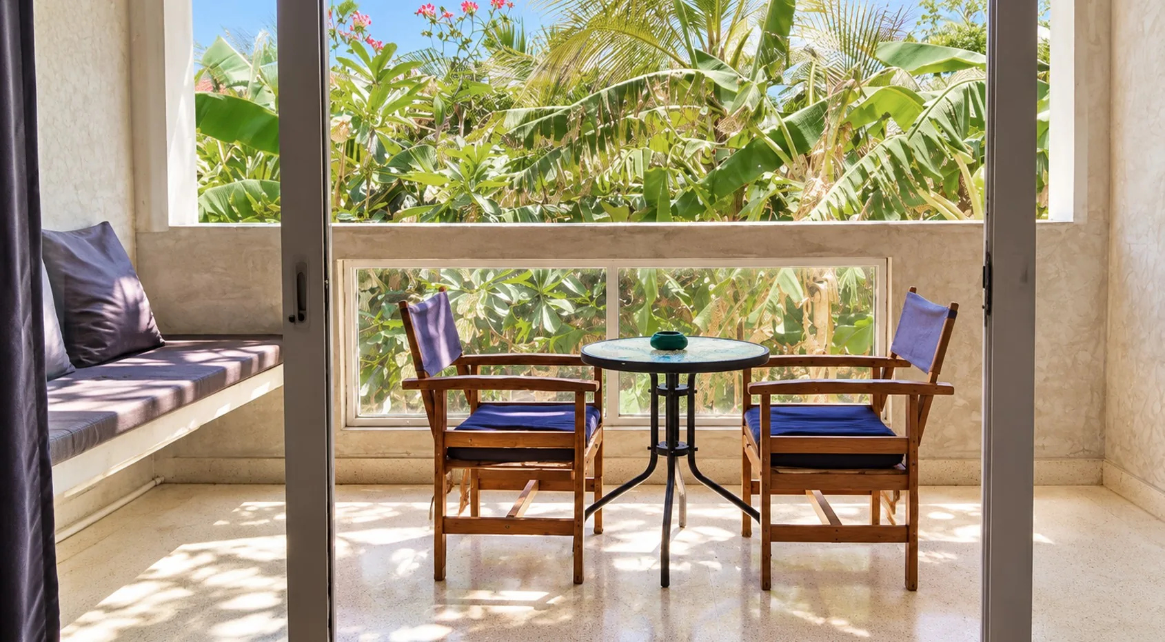 Balcony overlooking the tropical garden from the Garden View Room at Visiwa Beach Resort, Watamu