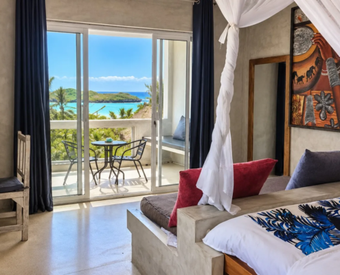 Ocean View Room at Visiwa Beach Resort, Watamu – canopy bed and balcony facing the Indian Ocean