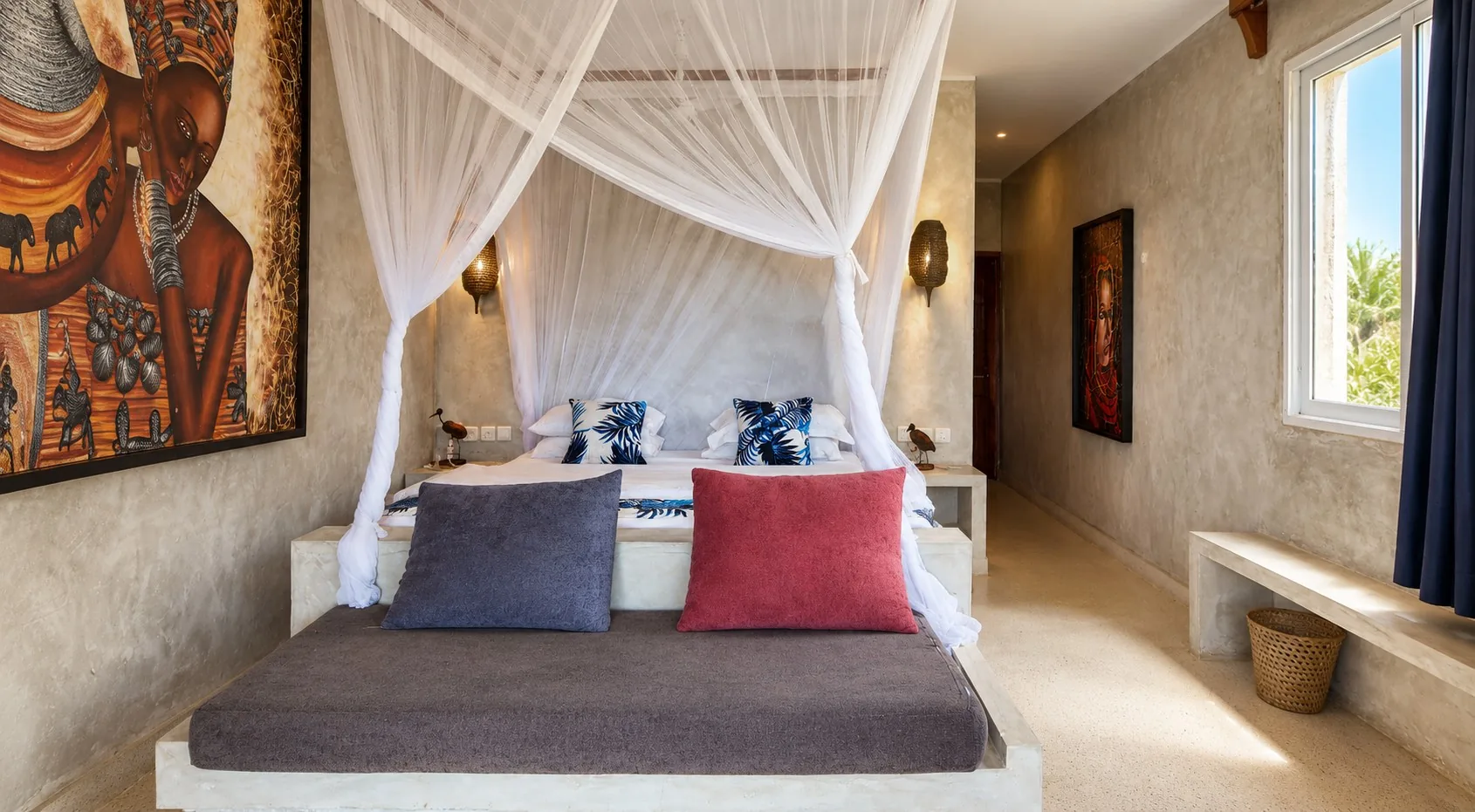 Ocean View Room canopy bed with African artwork at Visiwa Beach Resort, Watamu